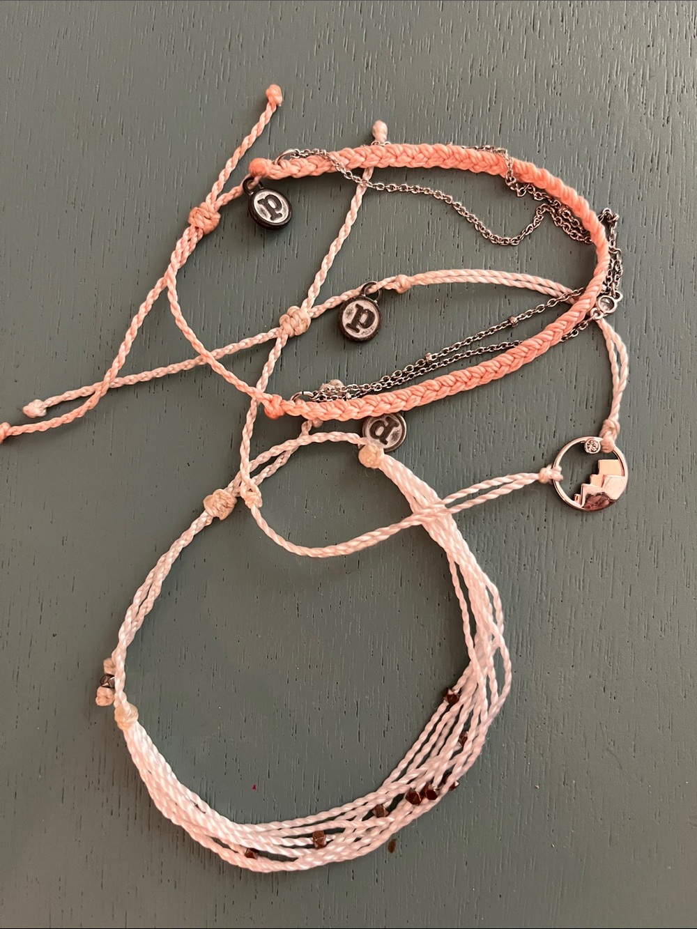 Three Pura Vida bracelets